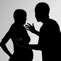 Silhouette of man and pregnant woman