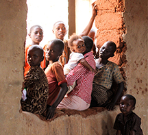 Children sitting inside a window in Rwanda