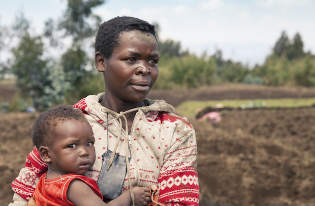 A mother holding her child.